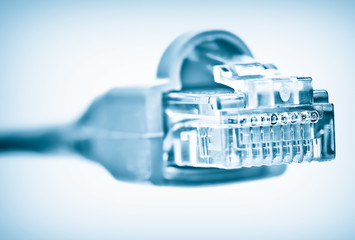 A network RJ45 connector on a blue vignetted background