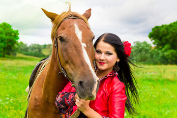 Beautiful gypsy girl with a horse