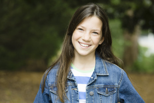 Caucasian girl smiling outdoors