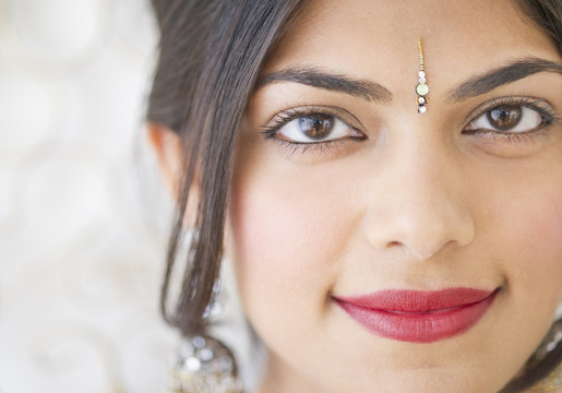 Mixed race woman with bindi on forehead