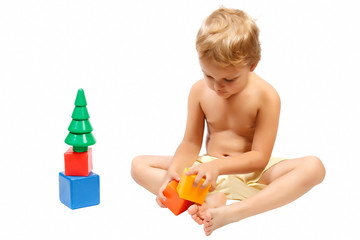 Little cute boy playing with colorful toys