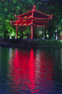Colorful Vietnamese pagoda near water