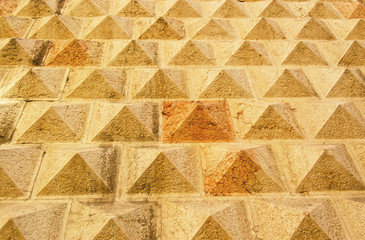 A close-up section of a sandstone wall  tiles