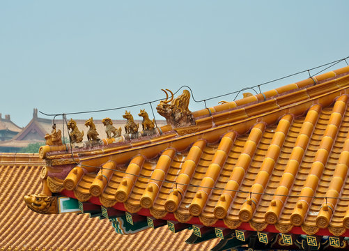 masterfully crafted figurines on a chinese roof