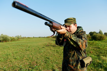 hunter with rifle gun