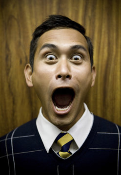 Shouting mixed race businessman