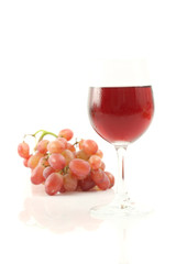 Red wine with grape isolated on white background