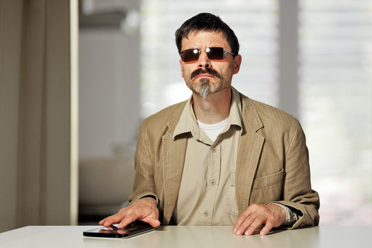 blind man with tablet pc