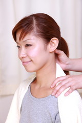 young japanese woman getting a massage