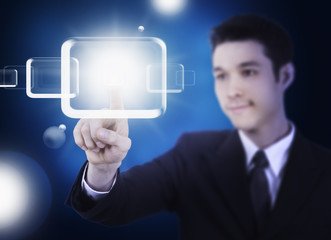 business man pressing a touchscreen button