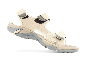 Side view of female travel sandal over white background