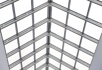 Glass roof with metal frames in an interior of modern office