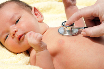 Stethoscope listening to a baby's heart beat