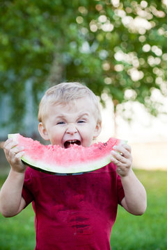 Boy eating watermelon
