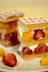 Layered waffles with fruit and cream