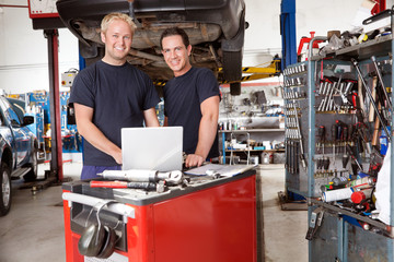 Portrait of smiling mechanics