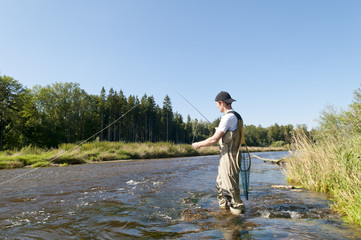 Naklejka premium Angler am Fluß