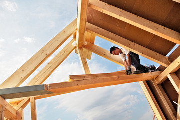 carpenters constructing a dormer