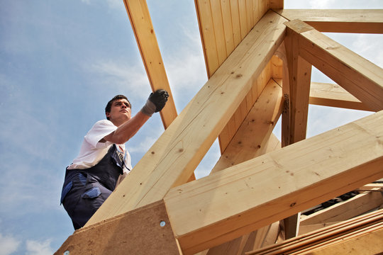 carpenters constructing a dormer