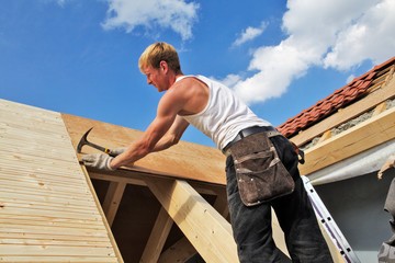 carpenters constructing a dormer