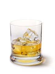Gold whiskey with ice cubes, on a white with shadow
