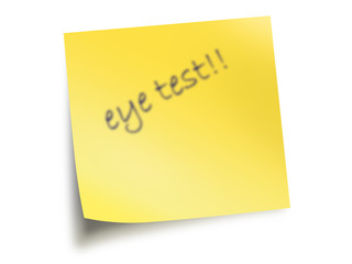 Yellow Post It Note With The Text Eye Test Blurred