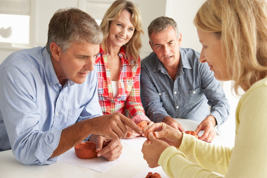 Mid age couples clay modelling