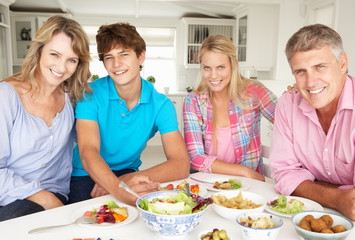 Obraz na płótnie Canvas Family enjoying meal at home