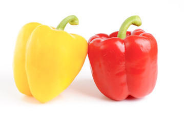 two red and  yellow pepper isolated on white background