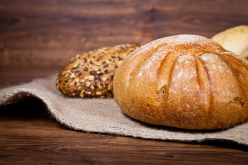 Composition of fresh bread on wood