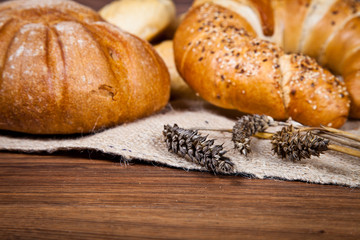Composition of fresh bread on wood