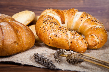 Composition of fresh bread on wood