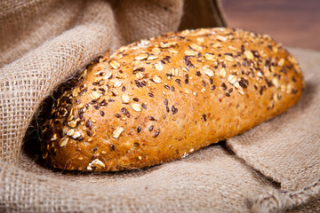 Composition of fresh bread on wood