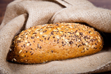 Composition of fresh bread on wood
