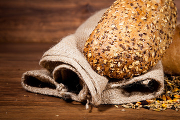 Composition of fresh bread on wood