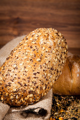 Composition of fresh bread on wood