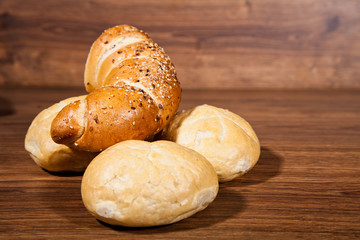 Composition of fresh bread on wood
