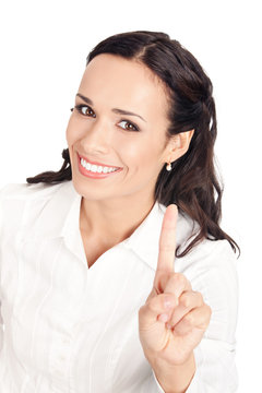 Businesswoman showing one finger, on white