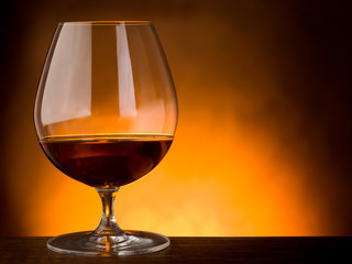 glass  of liquor on wood table with copy space