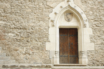 Traditional wooden door at Corvinilor Castle Hunedoara