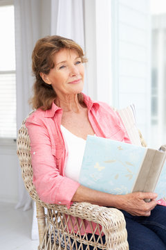 Senior Woman With Photo Album