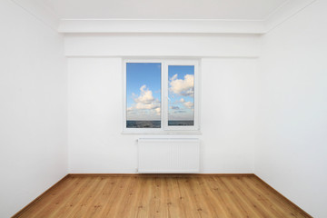 Small white room with sea view window
