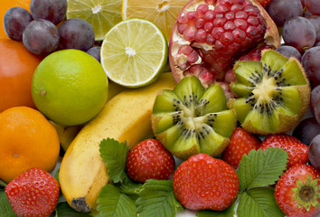 Bananas, kiwi grapes, pear, oranges, lemons, strawberry