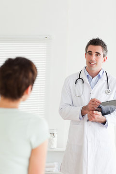 Doctor talking to a charming woman