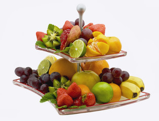 Fototapeta na wymiar Grenades, strawberry, kiwi, grapes, banana, tangerines