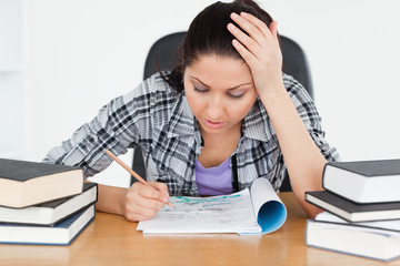 Tired young student learning