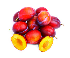 Delicious plums isolated on white background