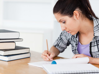 A young student is doing her homework