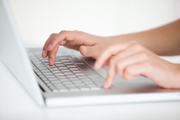 Fototapeta na wymiar Hands typing on keyboard