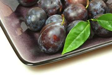 Plums with leaf